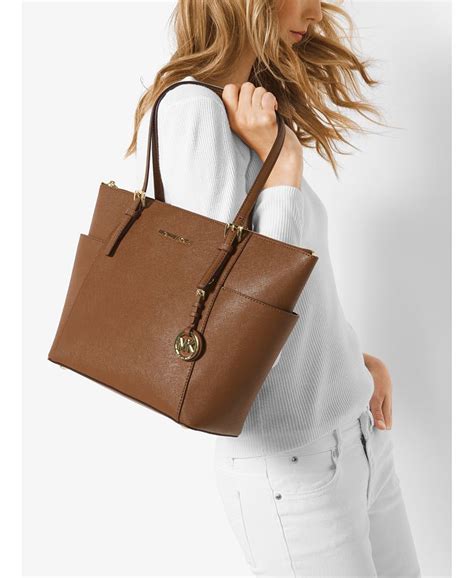 michael kors east west jet set top zip tote|mk saffiano leather tote bag.